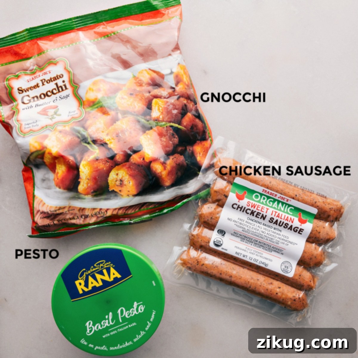 Easy Trader Joe's 3-Ingredient Recipes 3 A close-up view of roasted sweet potato gnocchi and golden-brown Italian chicken sausage on a sheet pan, showcasing their inviting texture.