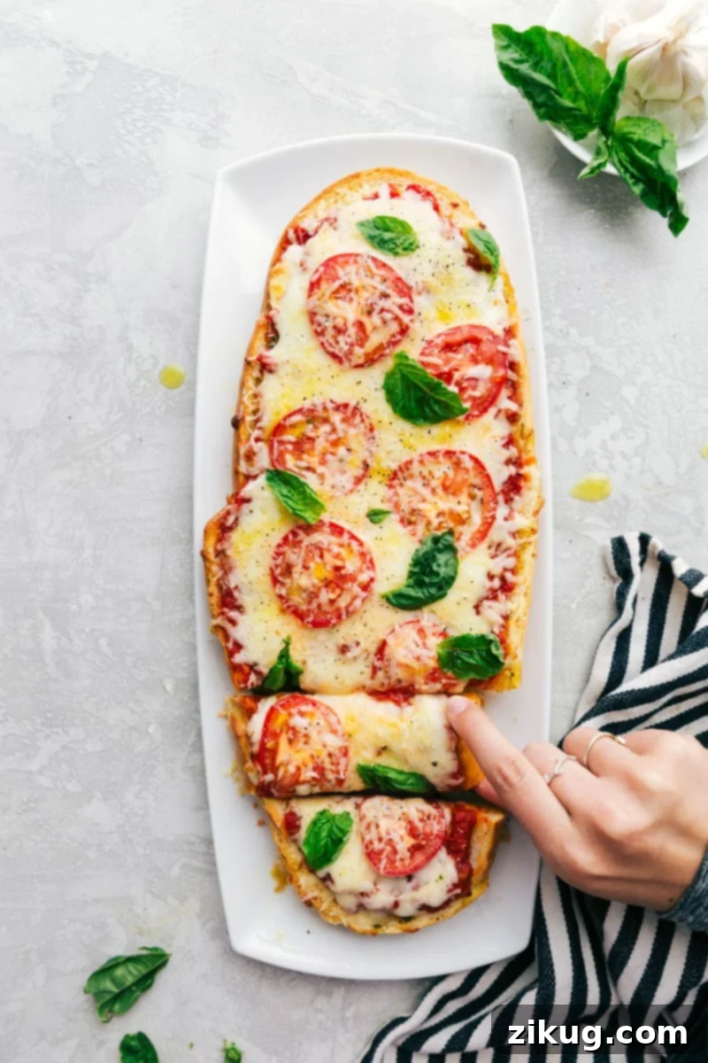 Crispy Baguette Margherita 4 Freshly baked Margherita French Bread Pizza garnished with fresh basil leaves