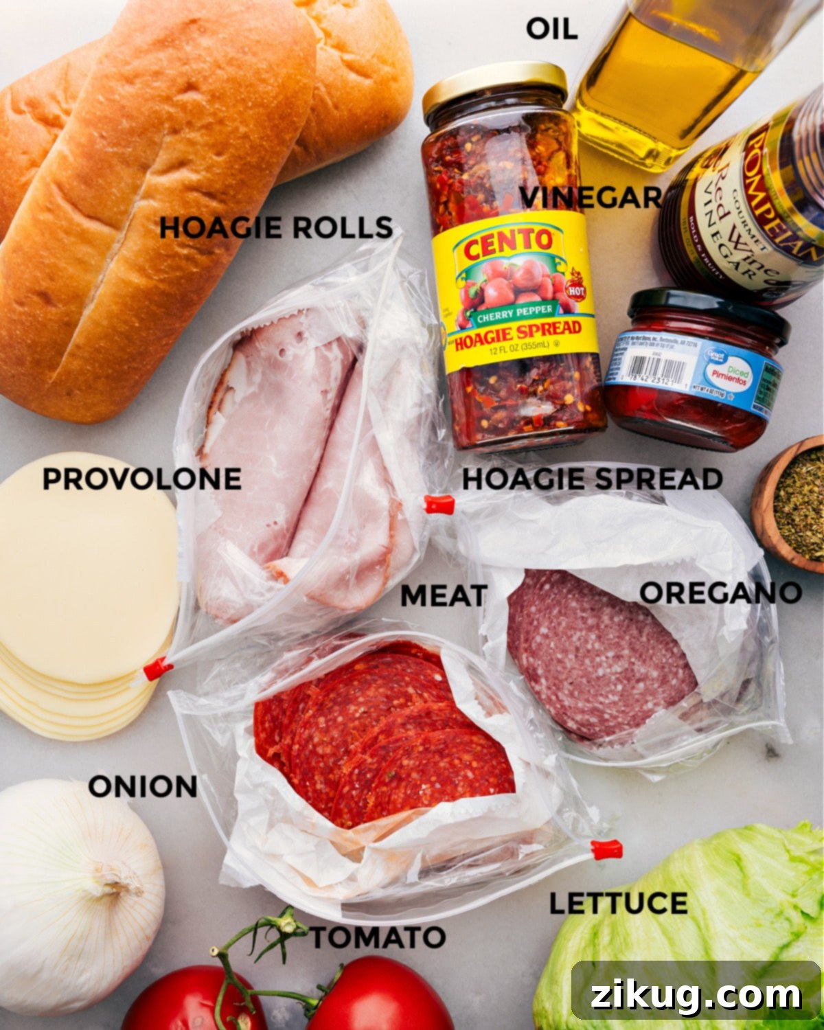 Ingredients In Italian Hoagies A vibrant selection of fresh ingredients including thinly sliced meats, cheese, tomatoes, onions, and lettuce, all prepped and ready for assembly into a delicious Italian Hoagie.