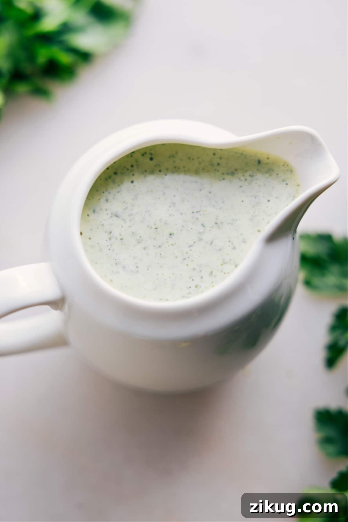Green Goddess Salad Dressing Recipe Green Goddess Dressing in a jar, perfect for dipping or drizzling over a salad.