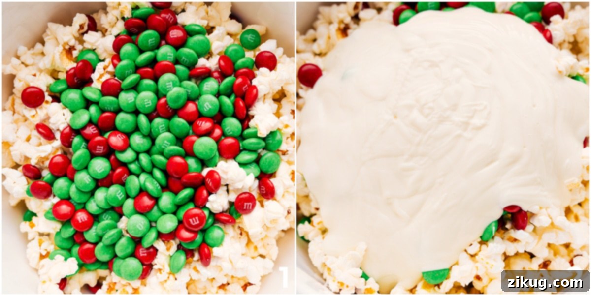Crafting Delicious White Chocolate Christmas Popcorn Melted white chocolate being poured over a mix of popcorn and Christmas M&M's on a sheet pan.