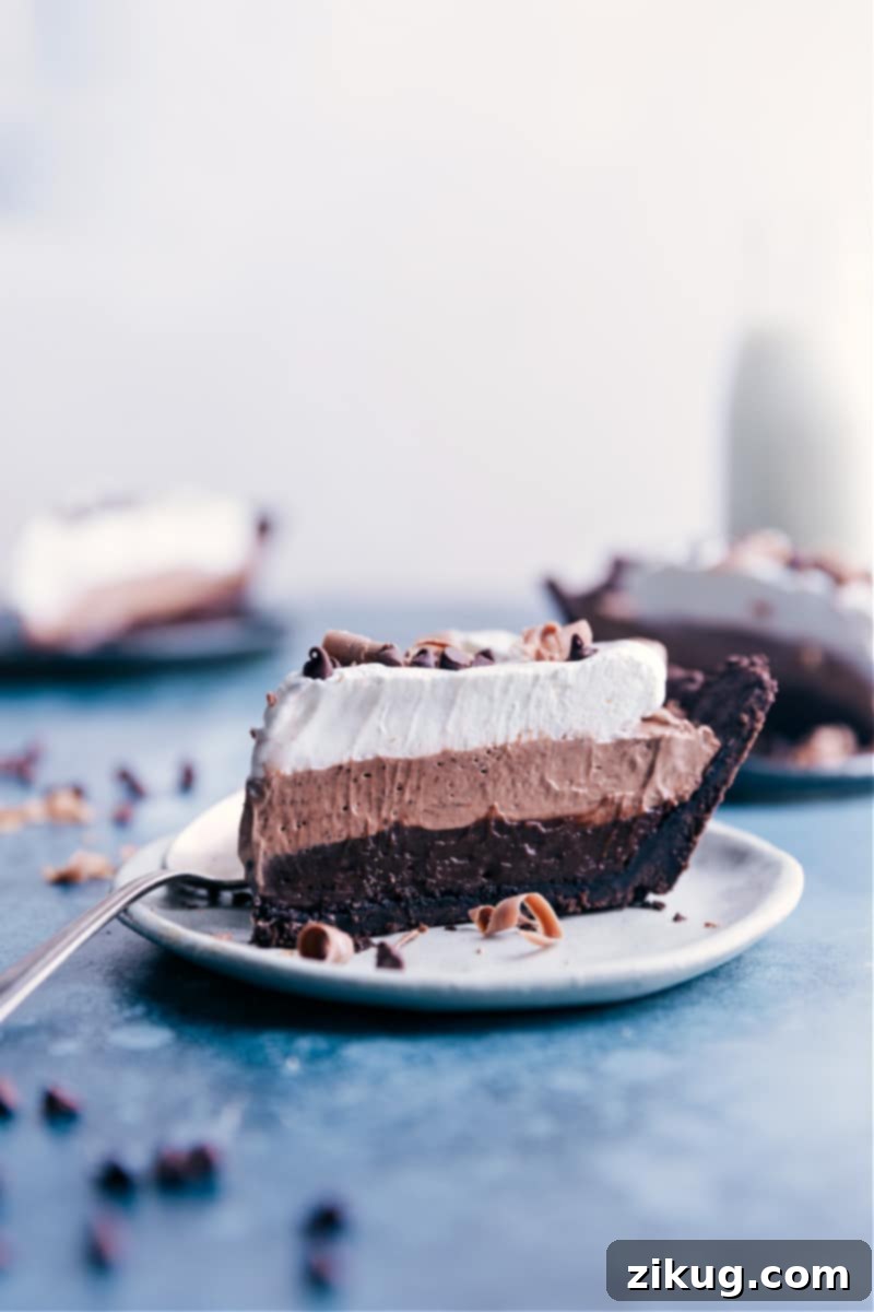 Velvet Chocolate Pudding Pie 9 A perfectly portioned slice of No-Bake Chocolate Pudding Pie, showcased on a plate and ready for immediate enjoyment.