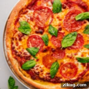 A freshly baked pizza with a golden crust, melted cheese, and vibrant toppings, invitingly presented.