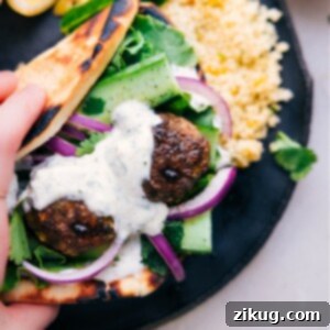 Beef Kofta Meatballs served in a pita with mint yogurt sauce and fresh toppings