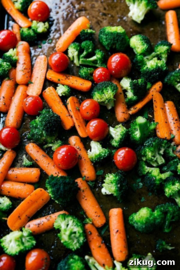 One Pan Balsamic Chicken and Vegetables 4 Freshly chopped broccoli, vibrant baby carrots, and juicy cherry tomatoes ready to be roasted alongside balsamic chicken.
