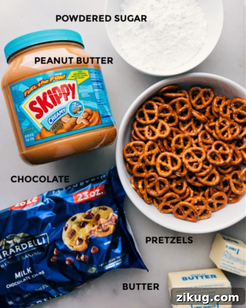 Sweet and Salty Peanut Butter Pretzel Bars 3 Ingredient shot showing all the essential ingredients for Peanut Butter Pretzel Bars, including pretzels, peanut butter, chocolate chips, butter, and powdered sugar.