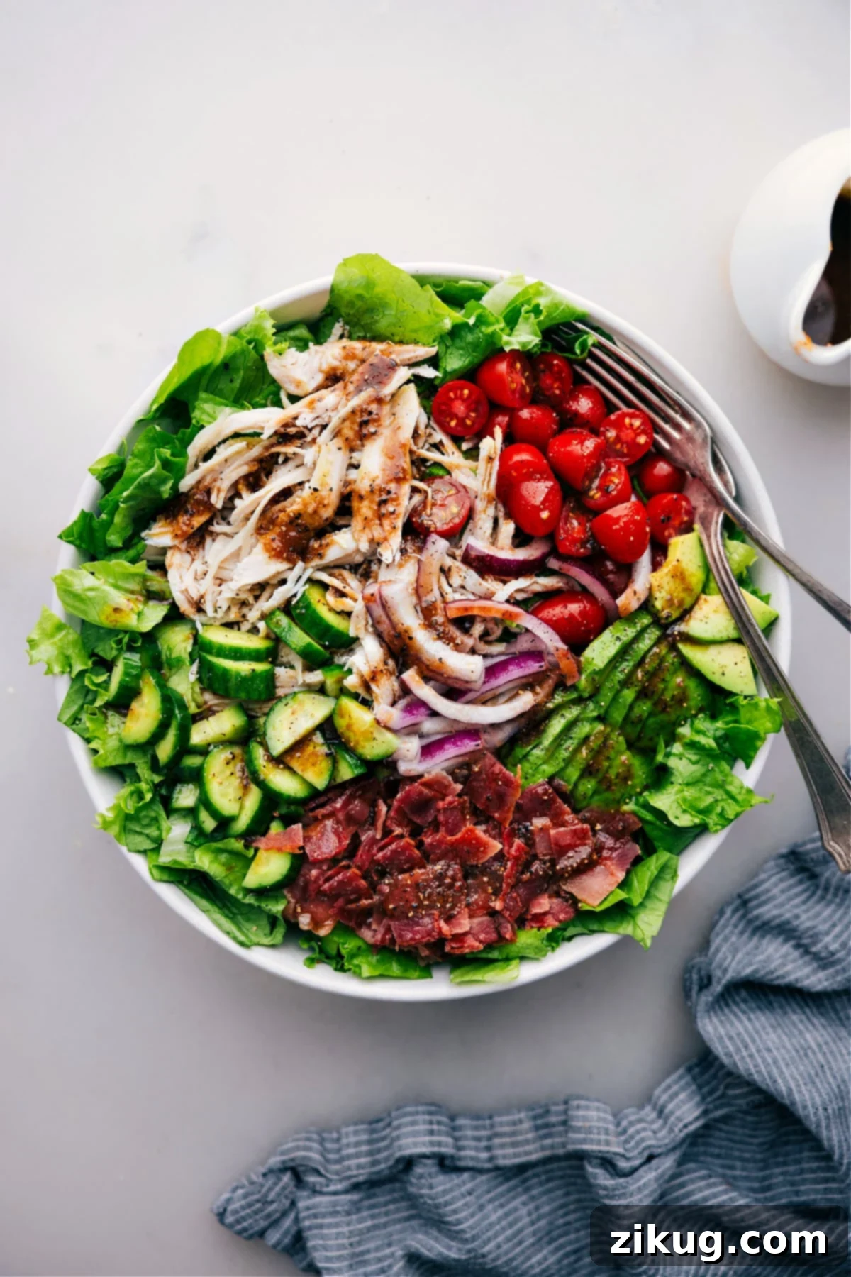 Big Bowl Of Turkey Bacon Avocado Salad A generously portioned Turkey Bacon Avocado Salad, perfectly dressed and ready to be enjoyed, showcasing a vibrant mix of fresh ingredients.