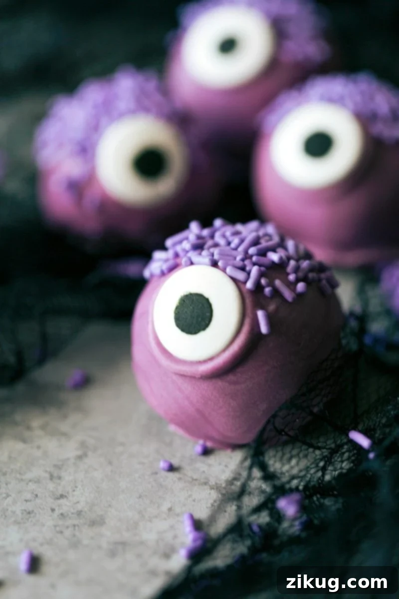 Spooktacular Oreo Truffles 2 Four adorable and festive Halloween Oreo Balls: a purple monster, an orange pumpkin, a brown bat, and a white mummy, each made with 5 ingredients or less.