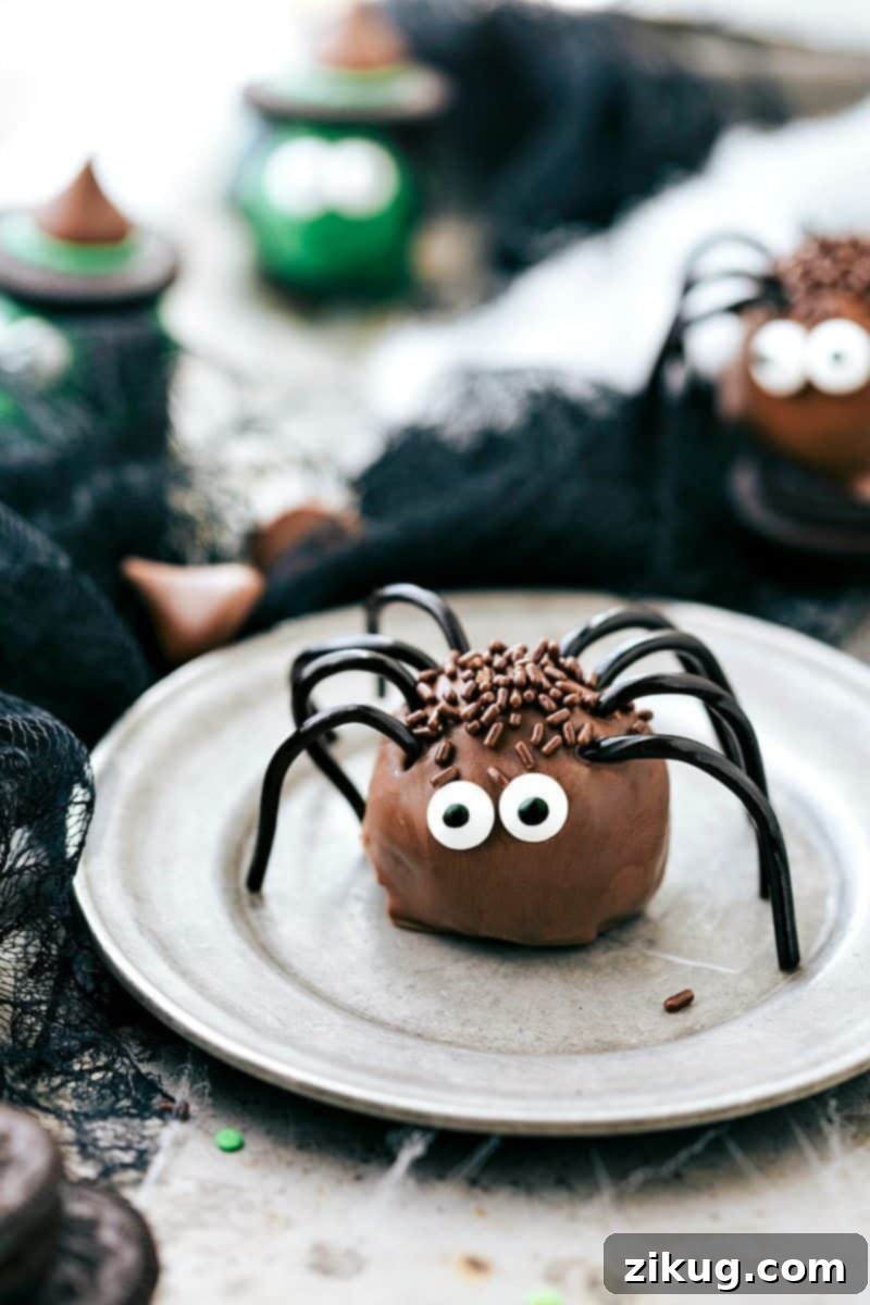 Spooktacular Oreo Truffles 8 Chocolate spider Oreo balls with black licorice legs, edible eyes, and brown sprinkles, making a delightfully spooky Halloween dessert.
