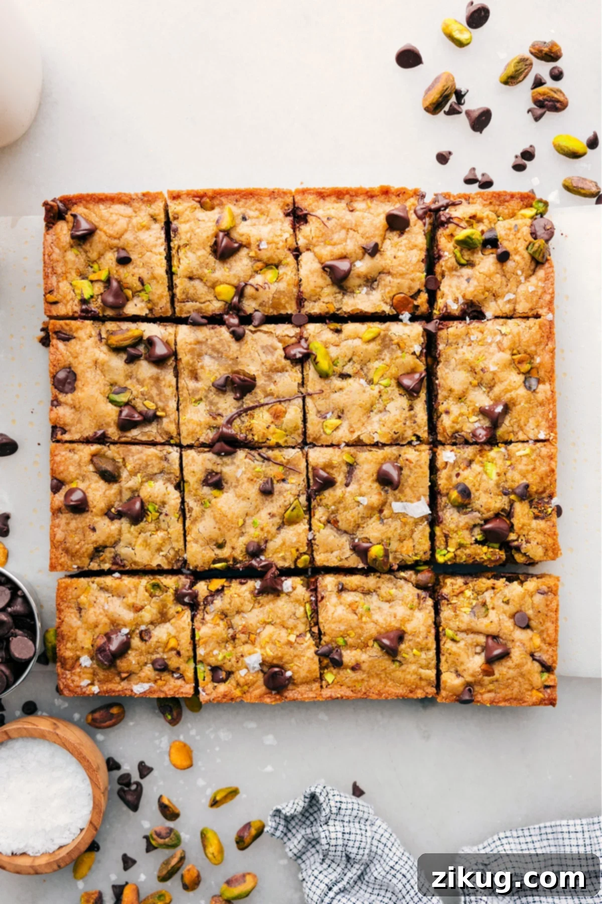 The Best Chewy Blondies Recipe The best blondie recipe cut into golden-brown bars, featuring an array of delicious baked-in toppings like chocolate chips and nuts.
