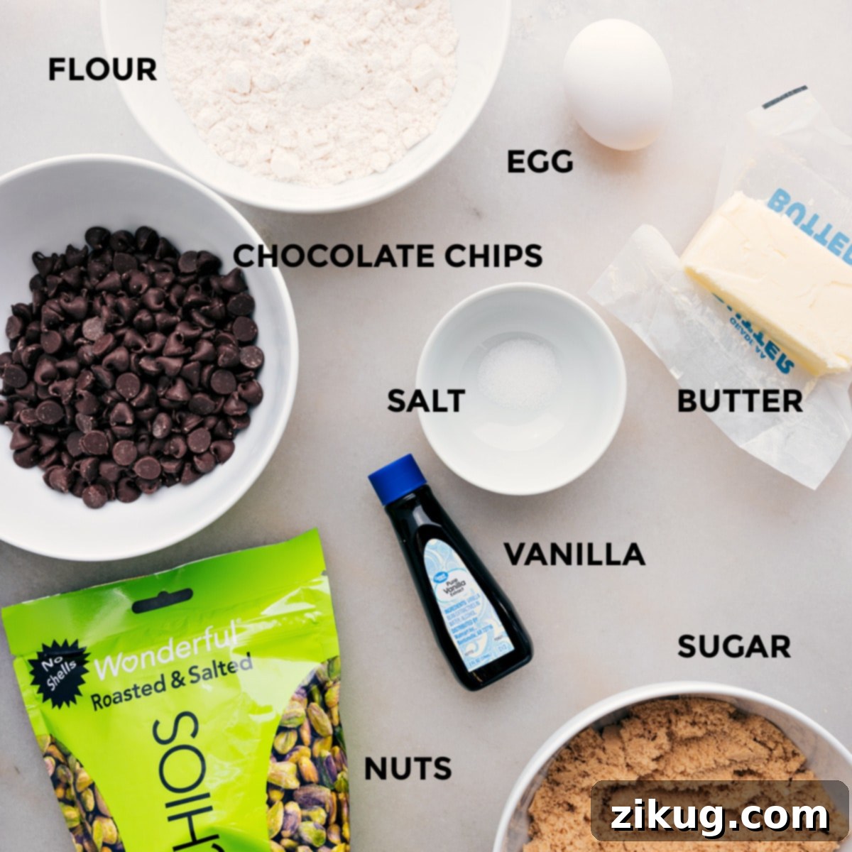 Key Ingredients for Delicious Blondies All the essential ingredients for the blondie recipe laid out: flour, salt, browned butter, vanilla bean paste, light brown sugar, roasted pistachios, chocolate chips, and a large egg, prepped for easy mixing.