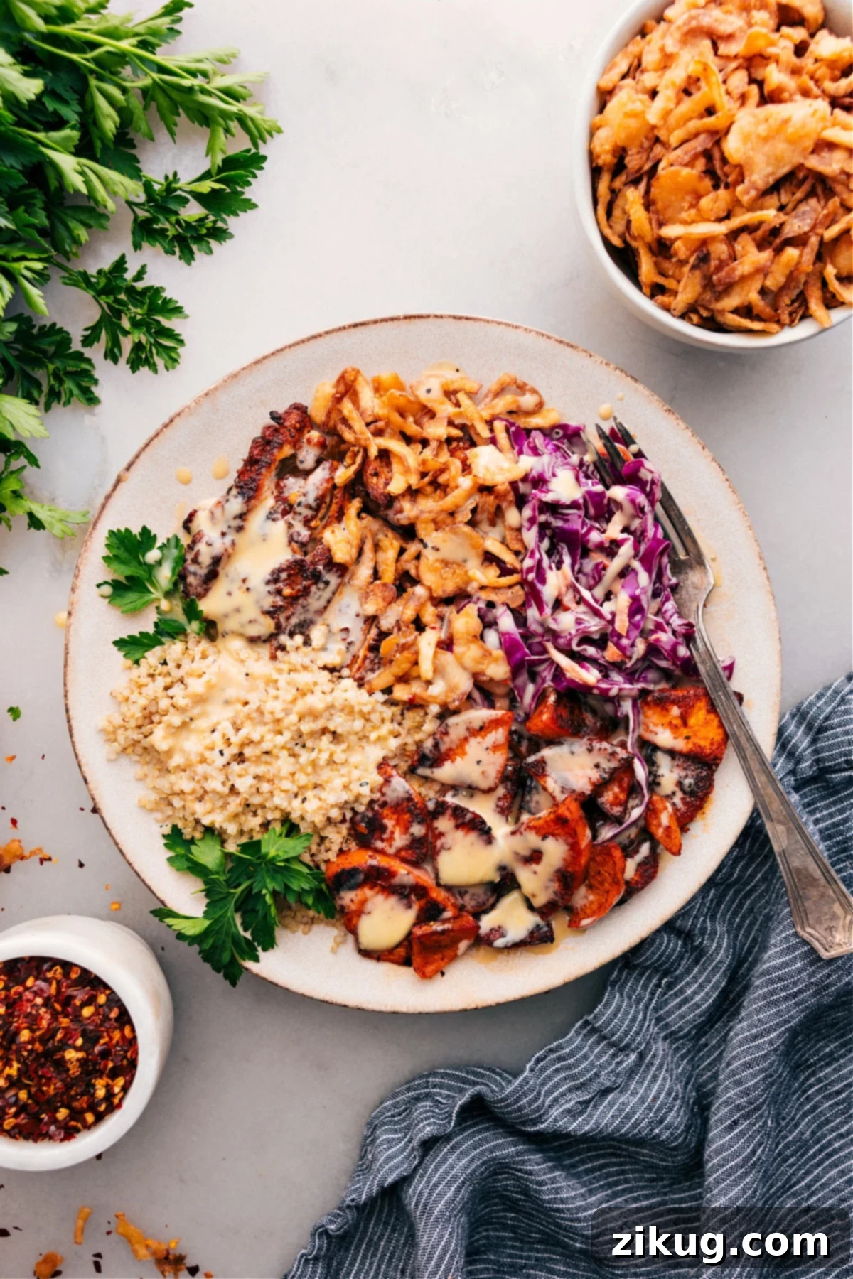The Best Hot Honey Chicken Bowl Recipe: Sweetgreen Copycat A vibrant Hot Honey Chicken Bowl topped with creamy dressing and fresh herbs, ready to be enjoyed as a healthy and flavorful meal.