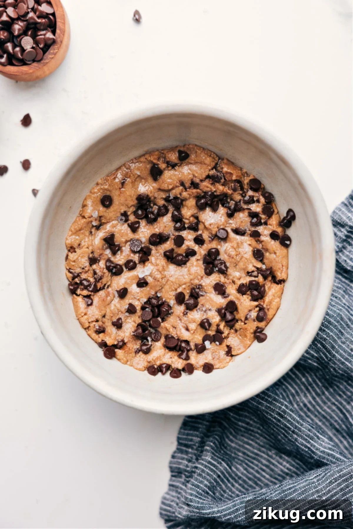 The Best Edible Protein Cookie Dough Recipe A bowl of delicious chocolate chip protein cookie dough, ready to eat.