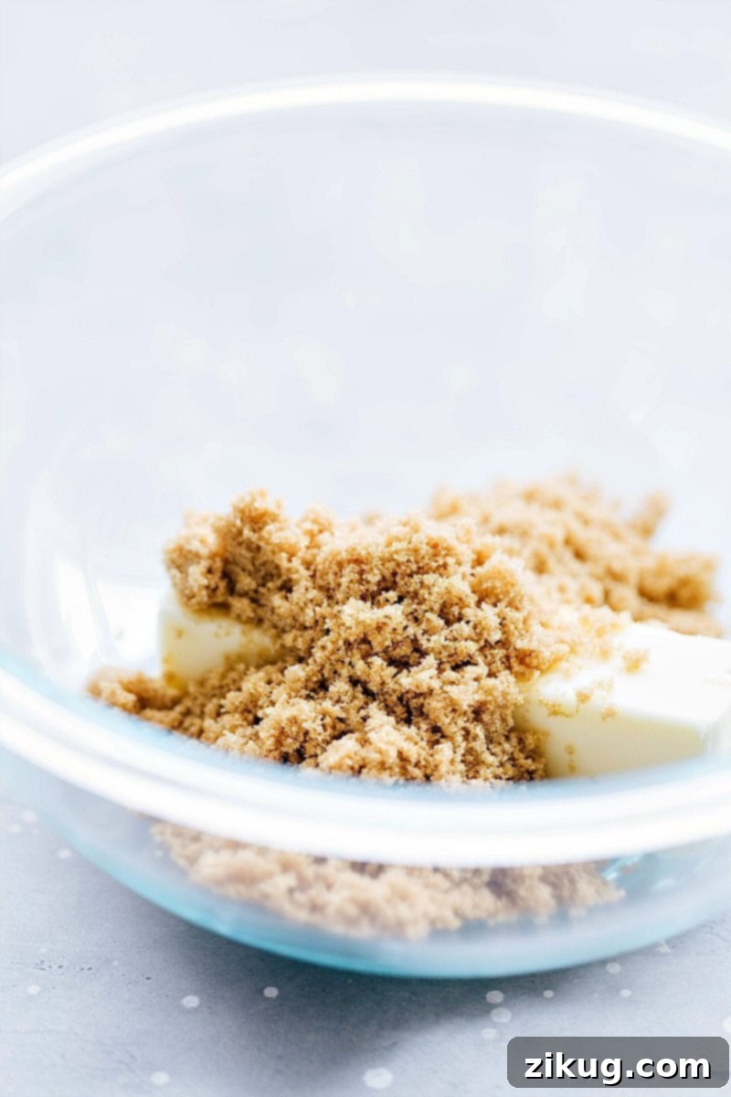 Essential Ingredients for the Best Homemade Oatmeal Creme Pies A mixing bowl filled with rich brown sugar and softened butter, perfectly prepared for blending the cookie dough.