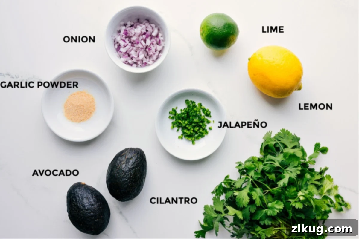 A vibrant display of fresh ingredients meticulously prepped for guacamole: bright green avocados, finely diced red onions, a sliced jalapeño, fresh cilantro leaves, zesty limes and lemons, and a small bowl of garlic powder.