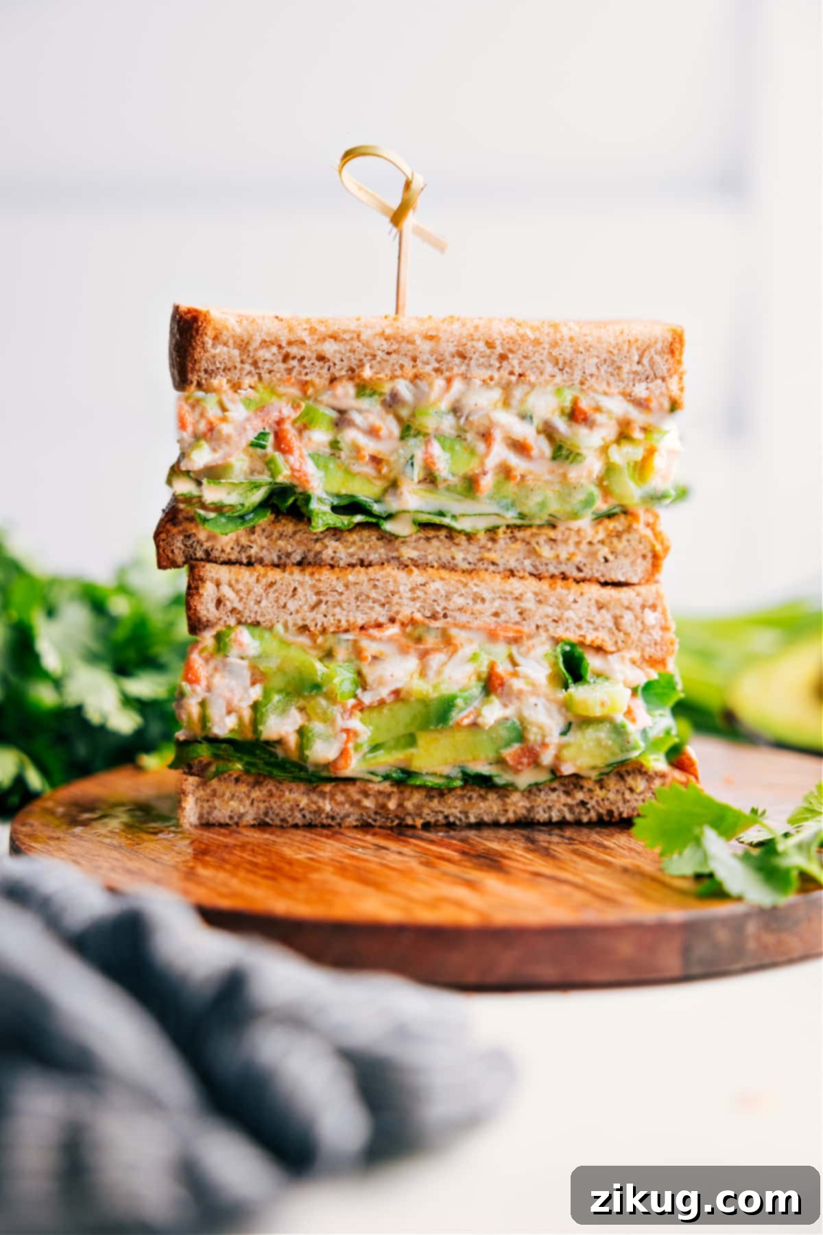 The Best Hot Honey Chicken Salad Sandwiches Hot Honey Chicken Salad sandwiches stacked on top of each other, showcasing the rich filling and toasted bread.