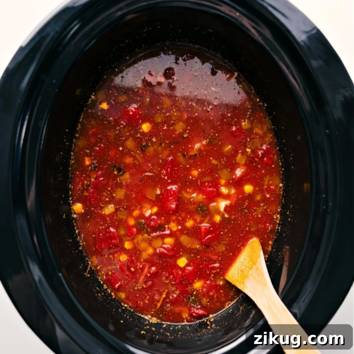 Simple Steps to Make Hearty Chicken Taco Soup in a Slow Cooker All the prepped ingredients for chicken taco soup, including chicken, beans, corn, tomatoes, and spices, are combined in a slow cooker, ready to be cooked.