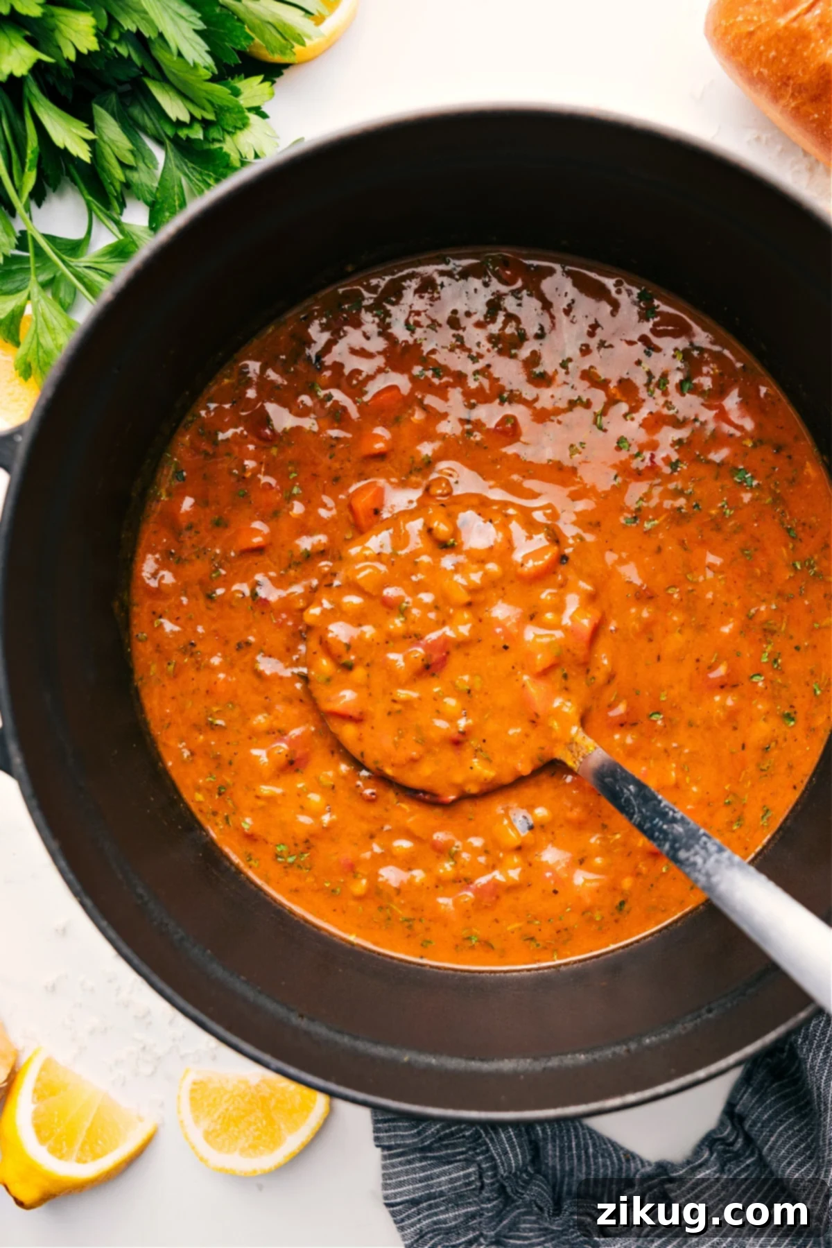 Nutritious And Flavorful Mediterranean Lentil Soup A large pot brimming with vibrant Mediterranean Lentil Soup, rich in color and texture, ready to be served and enjoyed.