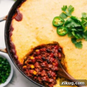 Delicious Cornbread Casserole with a scoop removed.