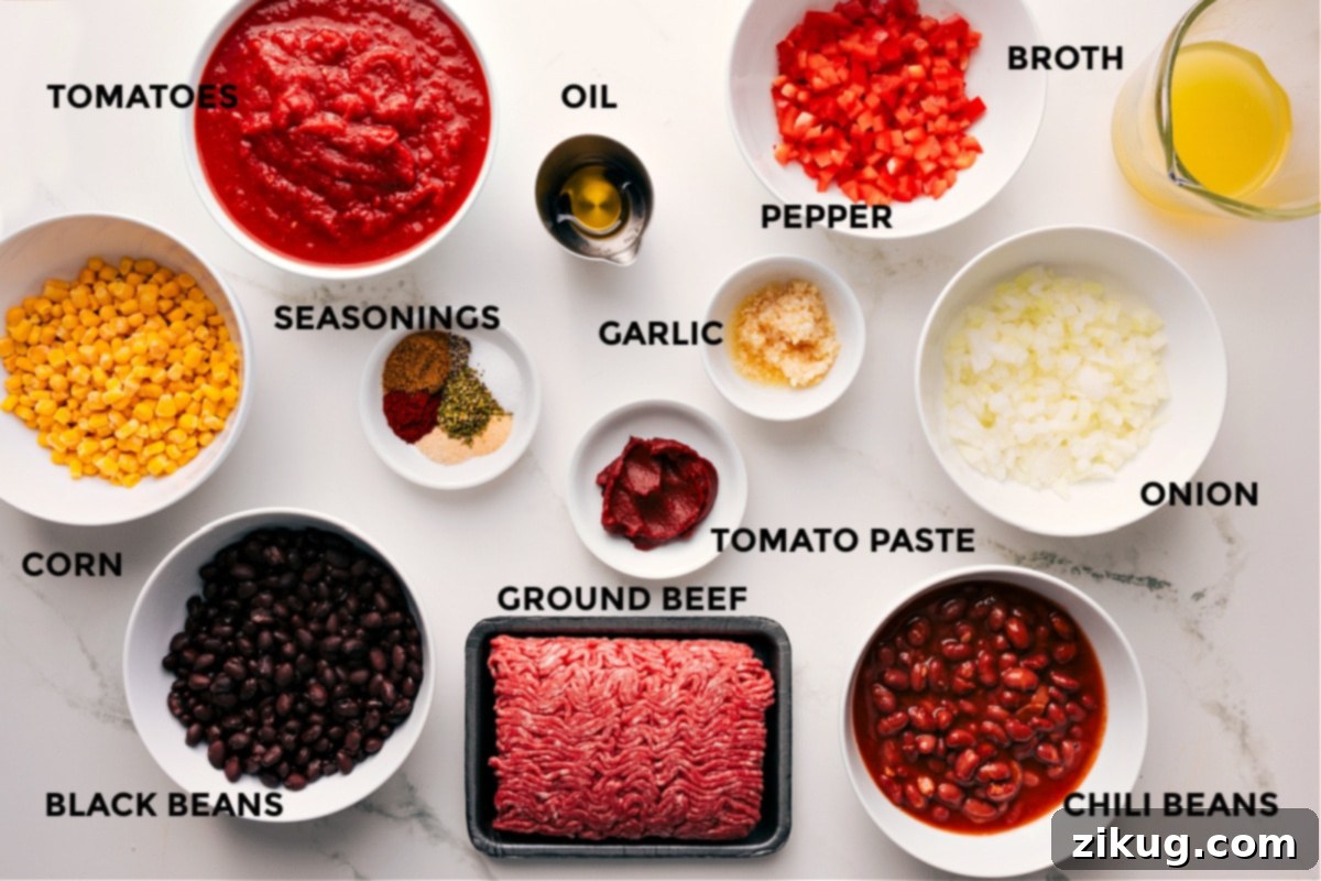 Essential Ingredients for a Perfect Cornbread Casserole Recipe A beautiful spread of fresh ingredients laid out for making the cornbread casserole, including vibrant bell peppers, onions, ground beef, canned beans, corn, spices, and wet ingredients for the cornbread.