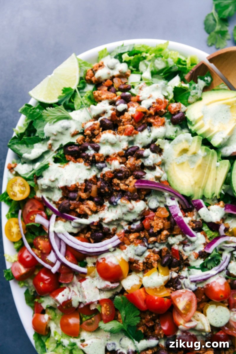 Colorful and Fresh Turkey Taco Salad Ready for Enjoyment Vibrant and colorful turkey taco salad, fully dressed and ready to serve, showcasing fresh ingredients.