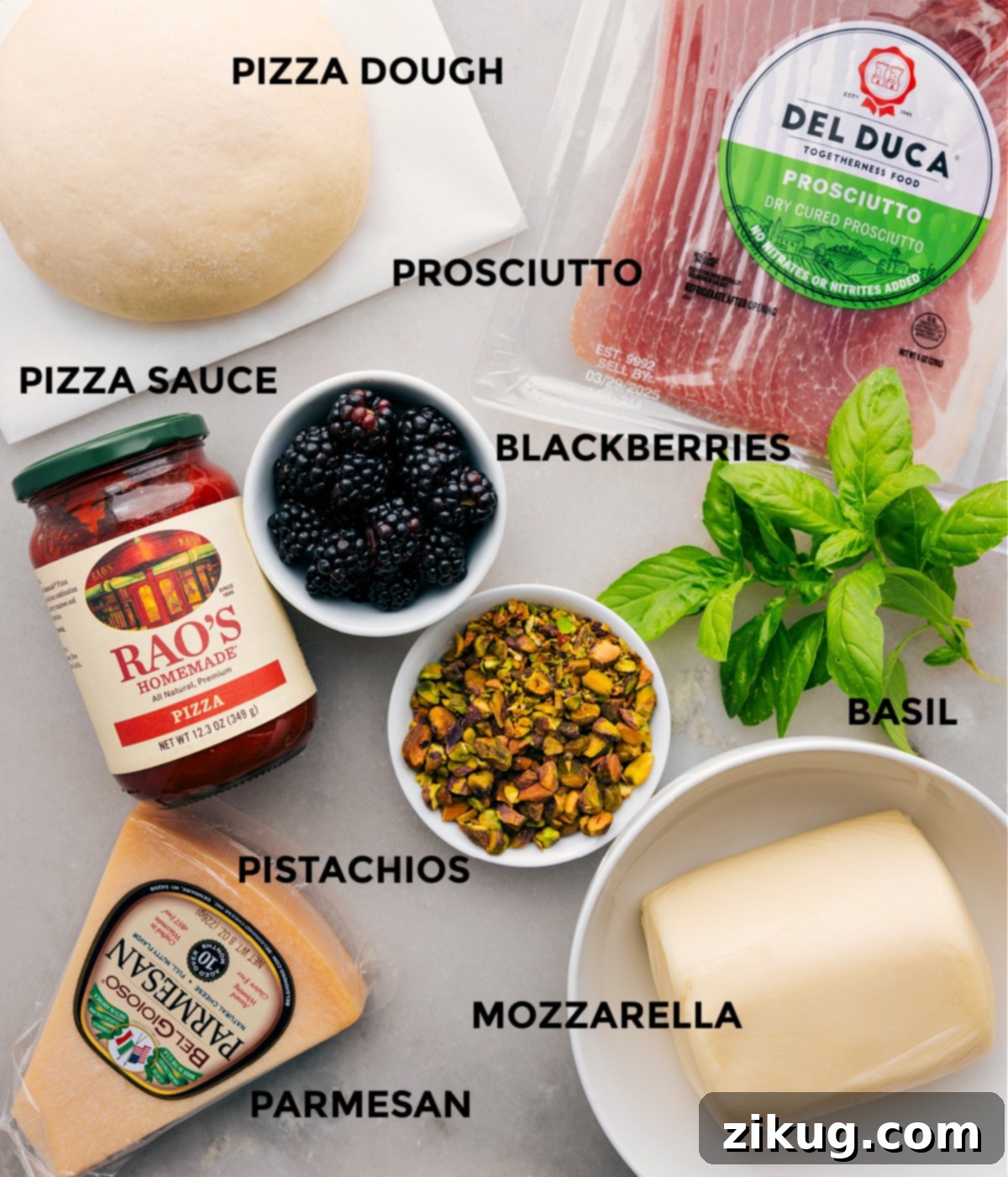 Ingredients In Fresh Basil Blackberry Pizza All the ingredients for this recipe are prepped and ready for easy assembly, including the dough, prosciutto, herbs, berries, sauce, cheese, and pistachios. High-quality ingredients for a gourmet pizza.