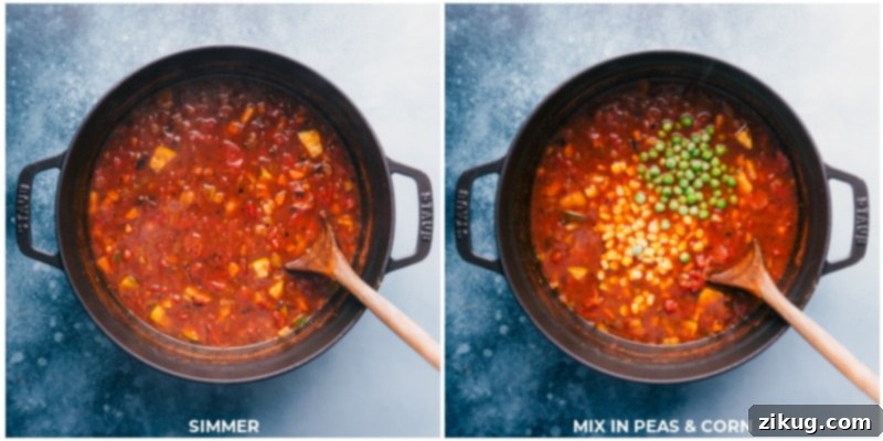 Skip The Trip To Olive Garden, Make This Delicious Soup At Home The homemade Olive Garden Minestrone Soup simmering gently in a pot, with peas and corn just added, highlighting its vibrant colors and rich texture.