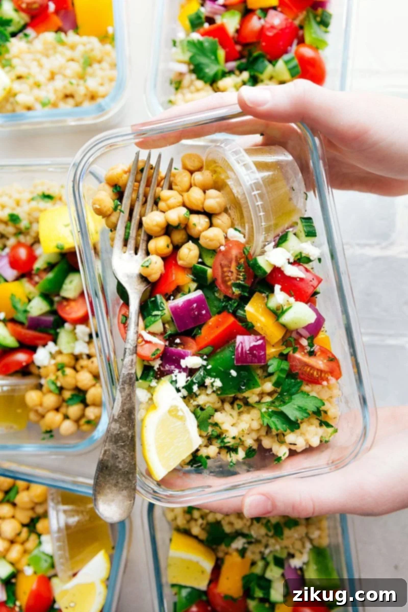Meal prepped Greek couscous salad containers lined up, ready for a week of healthy meals