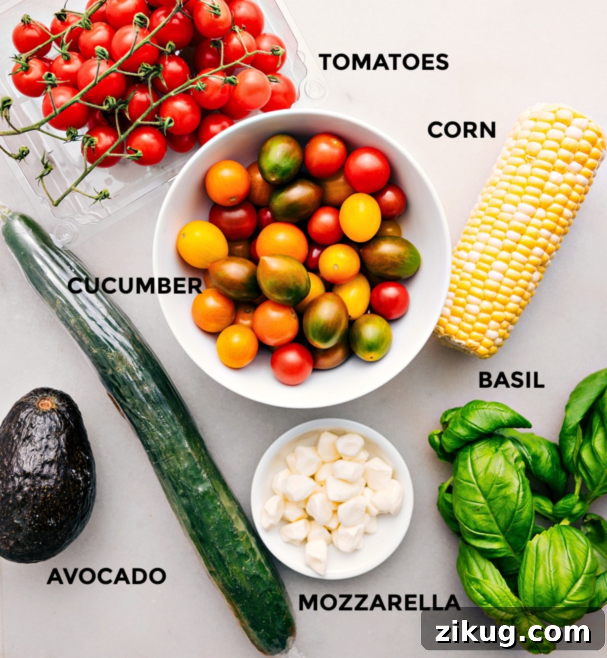 Fresh Ingredients For Panzanella Salad A flat lay of all fresh ingredients for Panzanella salad, meticulously prepped: vibrant cherry tomatoes, golden corn kernels, crisp cucumber slices, fresh basil leaves, creamy mozzarella pearls, and a ripe avocado.