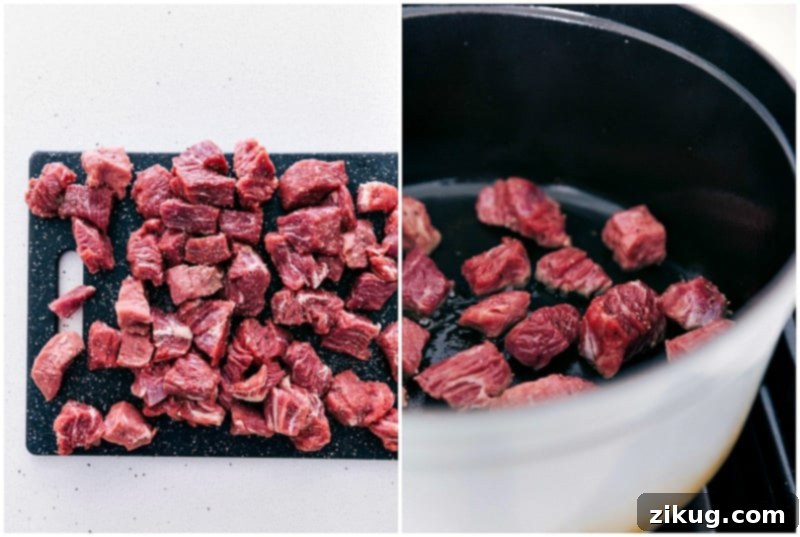 Prepping and seasoning the beef chuck roast, a crucial step for building deep flavor in our hearty Slow Cooker Beef and Barley Soup. Close-up shot of beef chuck roast being seasoned and prepared for the Slow Cooker Beef and Barley Soup, highlighting the rich marbling.