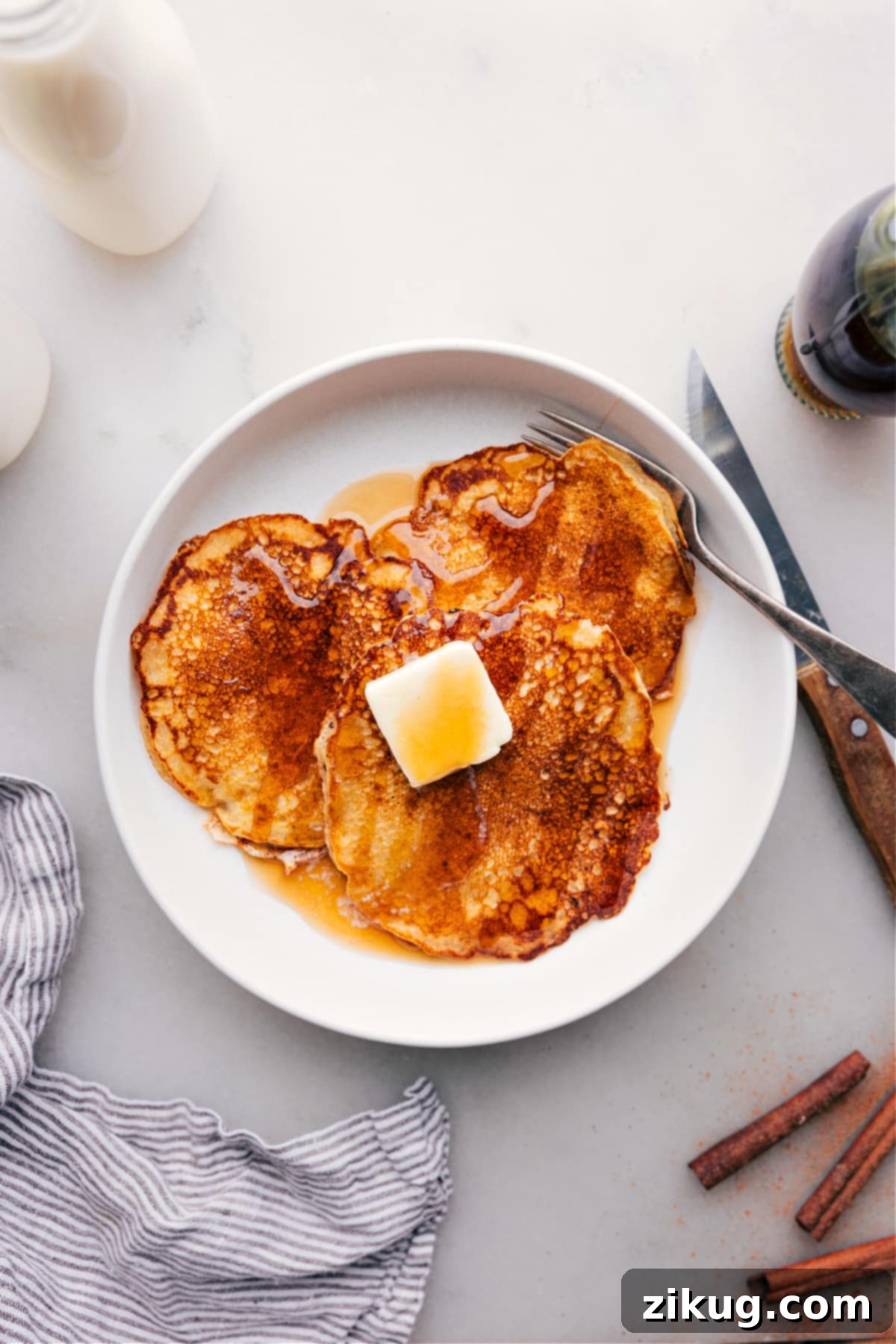 Sumptuous Pancake Stack with Syrup for an Irresistible Breakfast Delicious stack of Old-Fashioned Pancake Recipe drizzled with syrup on plate, ready to be enjoyed.