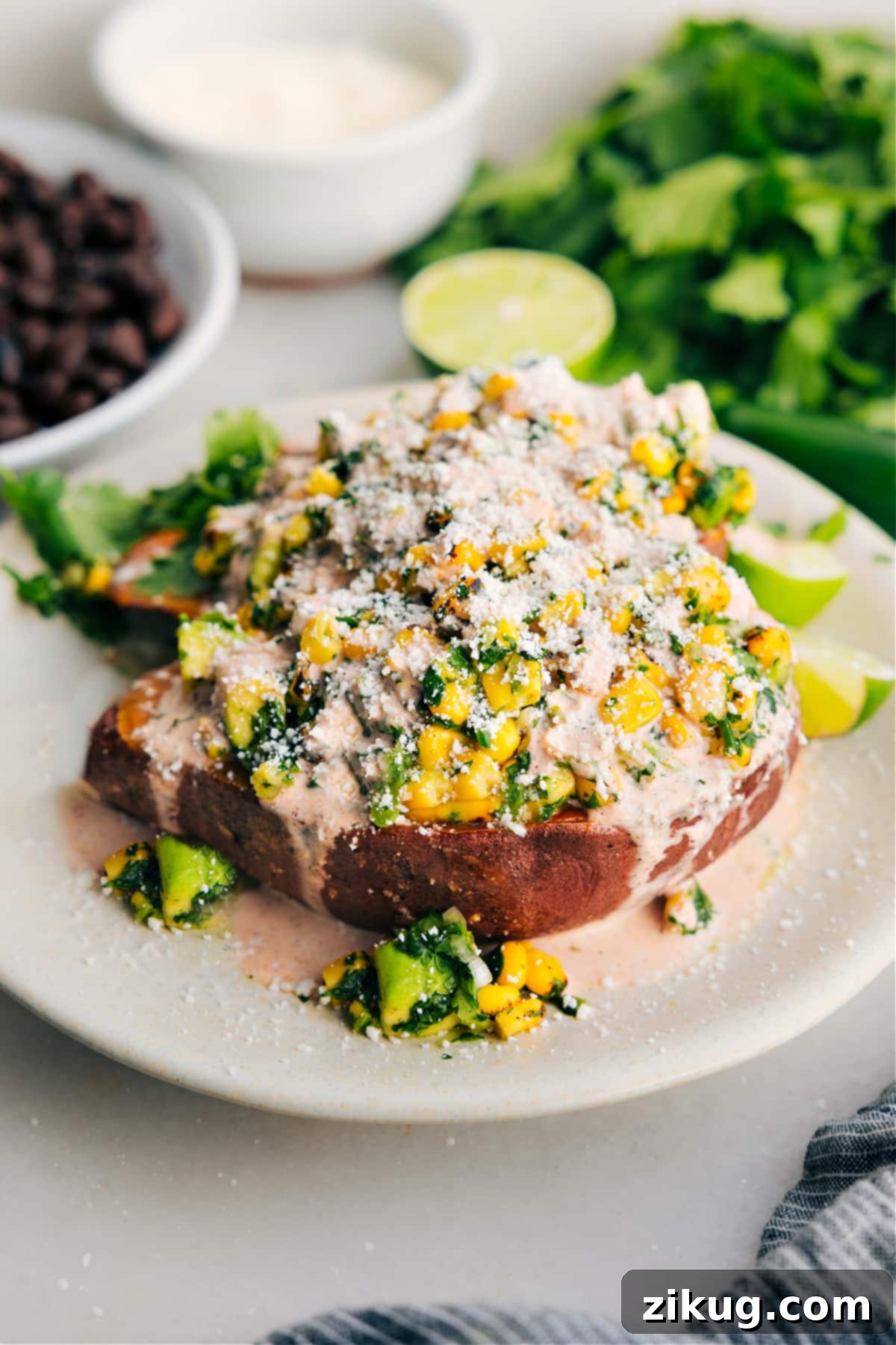 Mexican Street Corn Loaded Sweet Potatoes: An Easy, Flavorful & Healthy Recipe Delicious Mexican street corn loaded sweet potatoes topped with a creamy sauce and crumbled cotija cheese, garnished with fresh cilantro.
