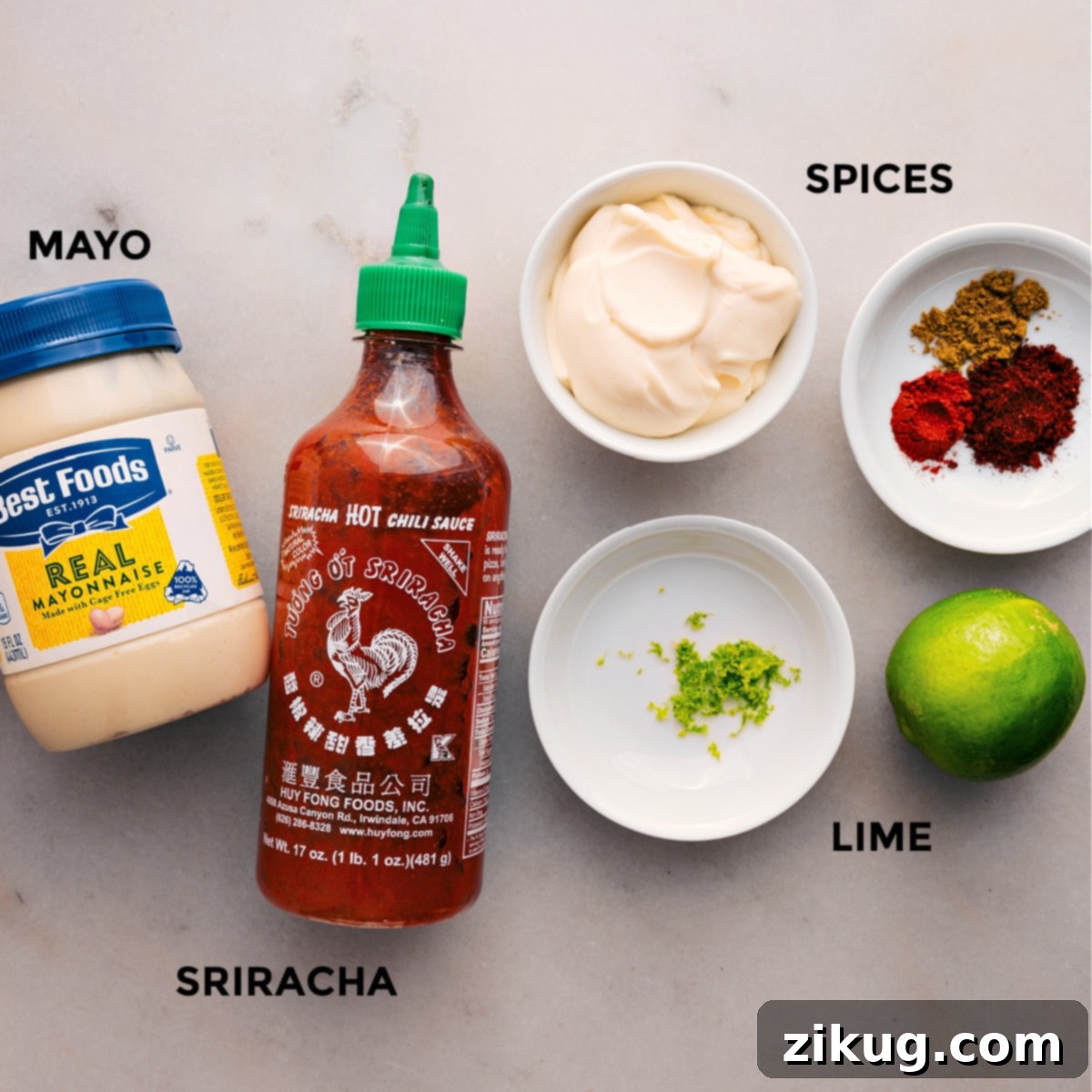 How To Prepare The Best Sauce For Loaded Sweet Potatoes All the sauce ingredients — including spices, mayonnaise, fresh lime, and Sriracha — perfectly prepped and ready for mixing.