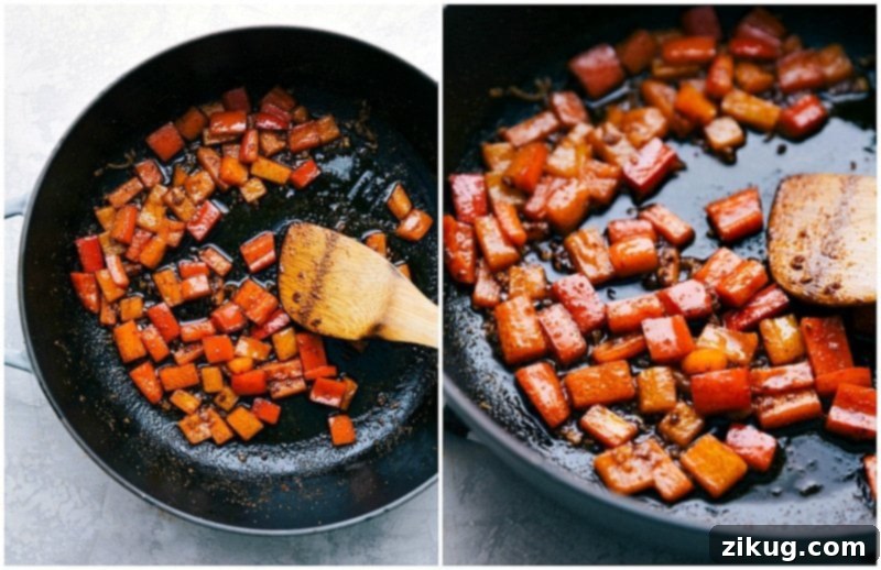 The easiest 20-minute Sausage and Potatoes Skillet Meal! This simple dinner can all be made in one pan and is loaded with flavor! Recipe via chelseasmessyapron #dinners #recipes #comfortfoods #simple #keilbasa #meals #healthy #sausage #onepanmeal #potatoes #quick Close-up image of vibrant red bell peppers being sautéed in a hot skillet, preparing for the Sausage and Potatoes Skillet meal.