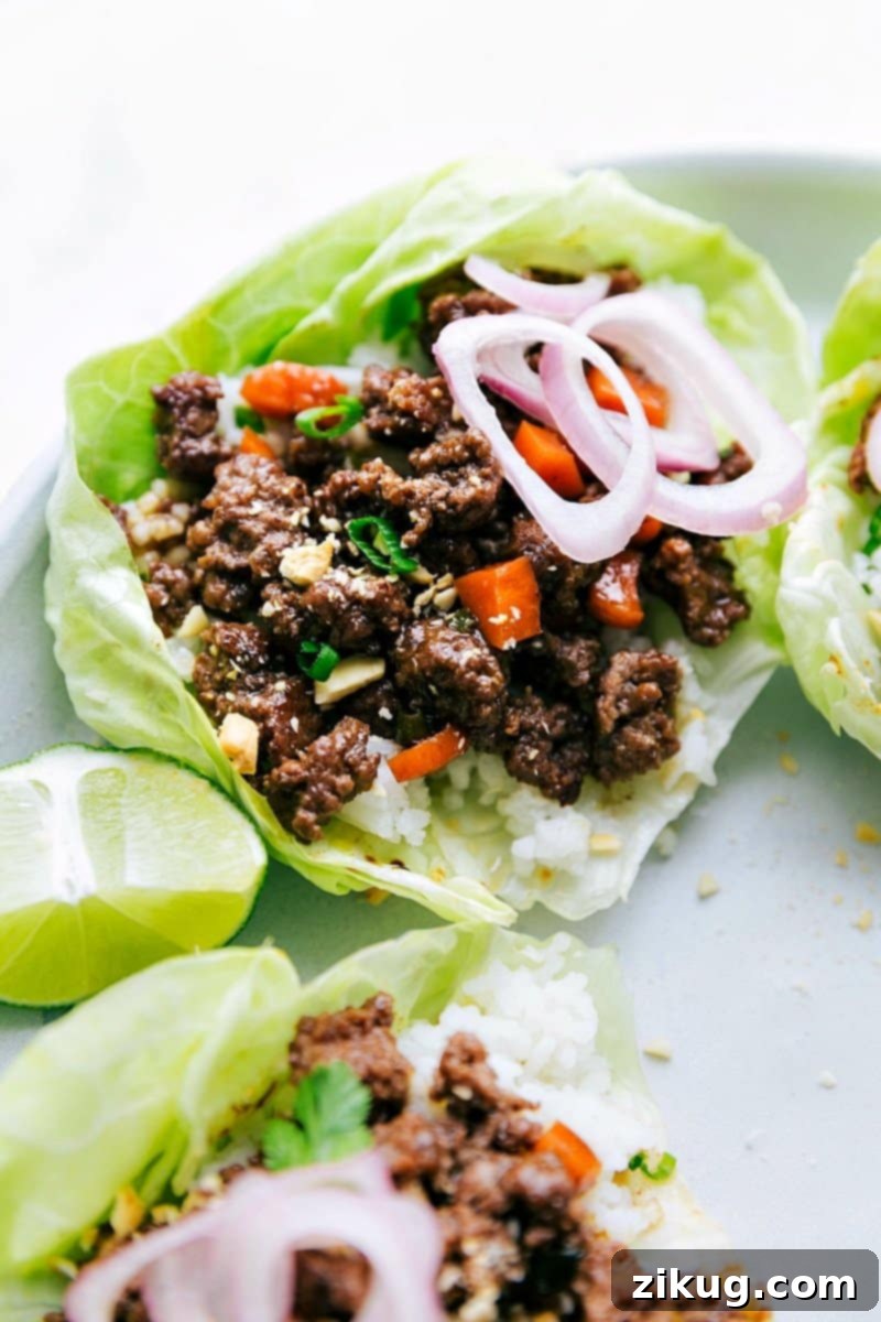 Finished Ground Beef Lettuce Wraps with Fresh Toppings The finished beef lettuce wraps, beautifully presented with fresh toppings and packed with delicious, savory flavor, ready to be enjoyed as a quick and healthy meal.