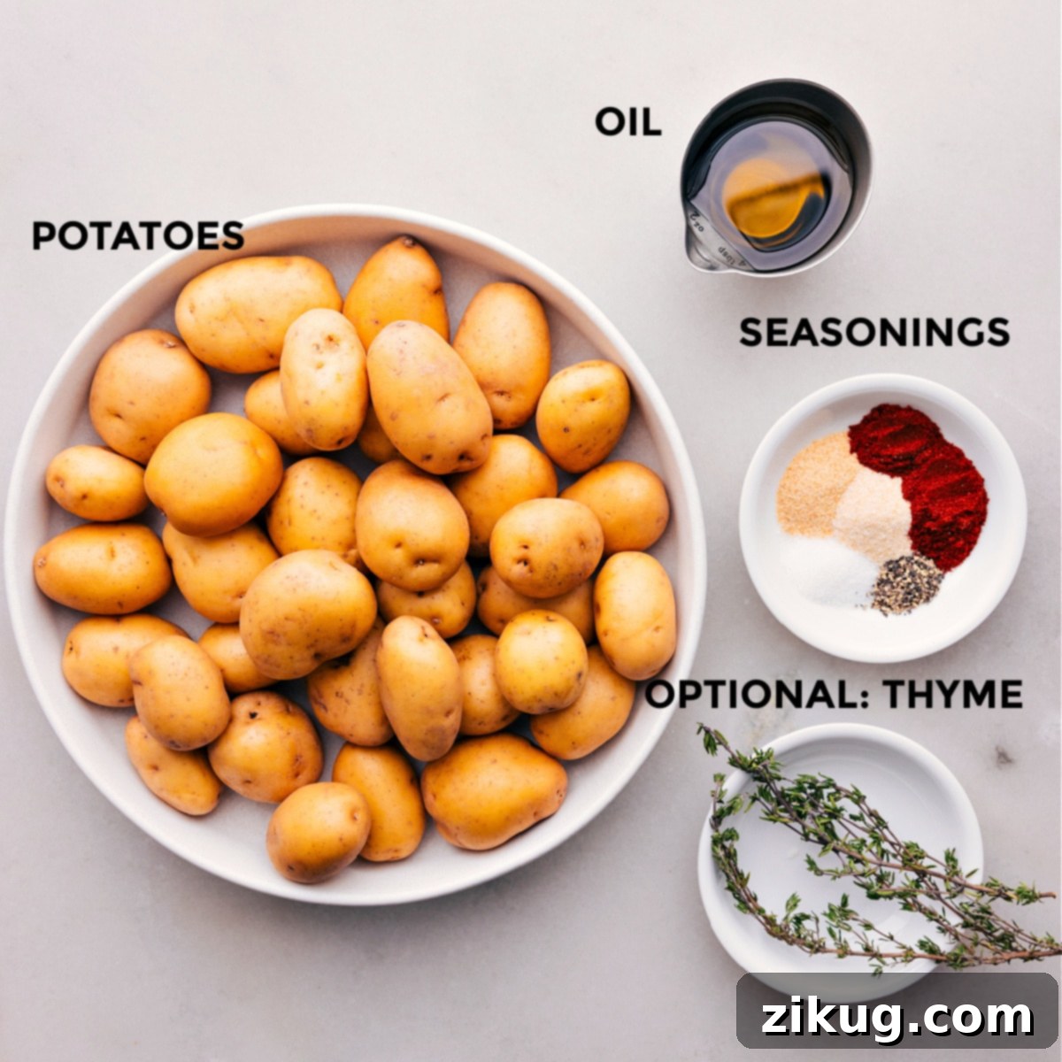 Perfectly Crispy Roast Potatoes 3 All the fresh ingredients for crispy roasted potatoes, neatly prepped and laid out on a kitchen counter, ready for easy preparation.