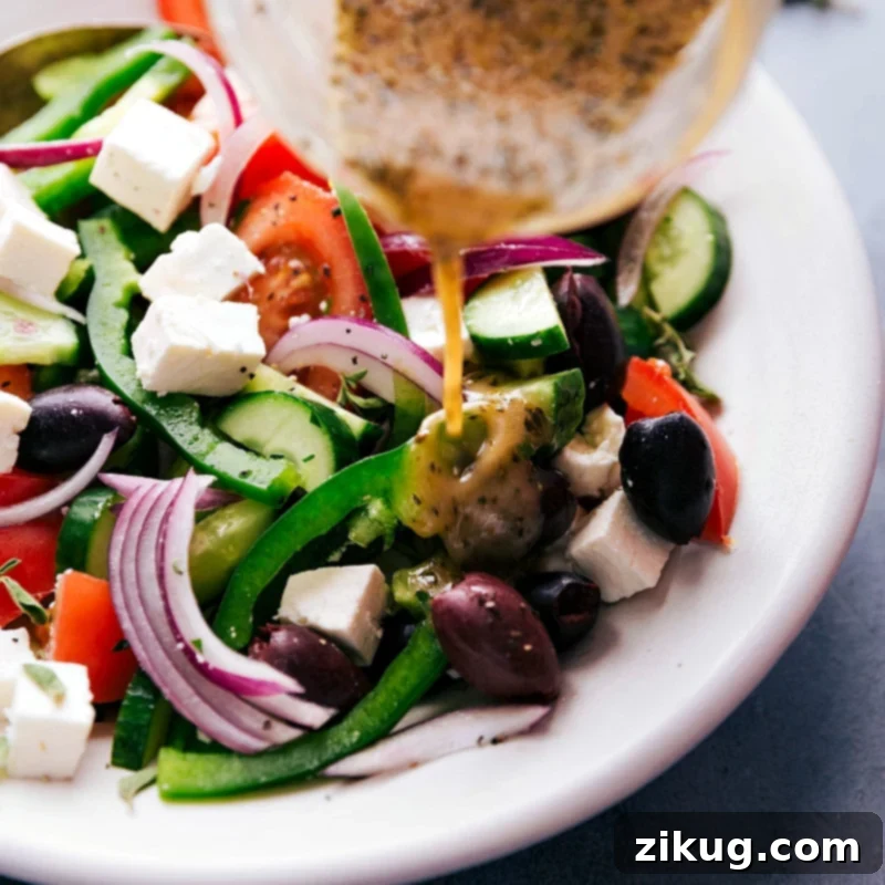 Pouring Delicious Dressing Over a Healthy Salad Dressing being poured over finished dish.