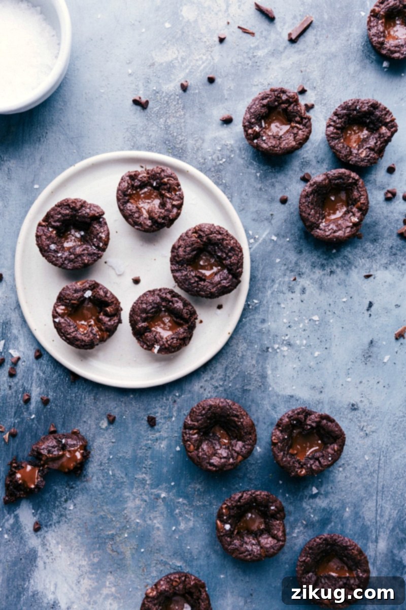 Indulgent Brownie Bites with Gooey Melted Chocolate Centers Plate filled with freshly baked mini brownie bites, their centers oozing with molten chocolate, ready to be enjoyed.