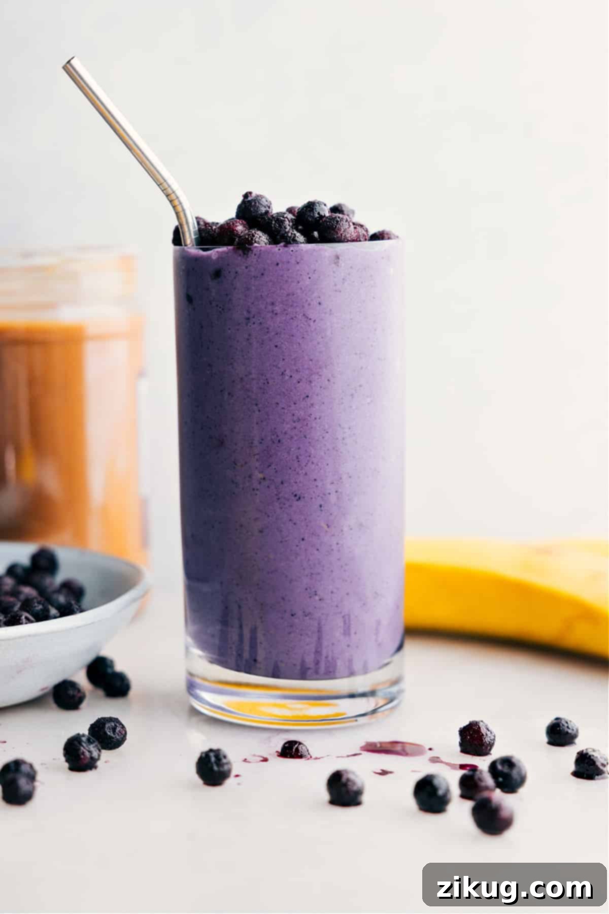 The Best Creamy Blueberry Smoothie Recipe A refreshing blueberry smoothie, perfectly blended and served in a glass, topped with fresh blueberries, ready to be enjoyed.