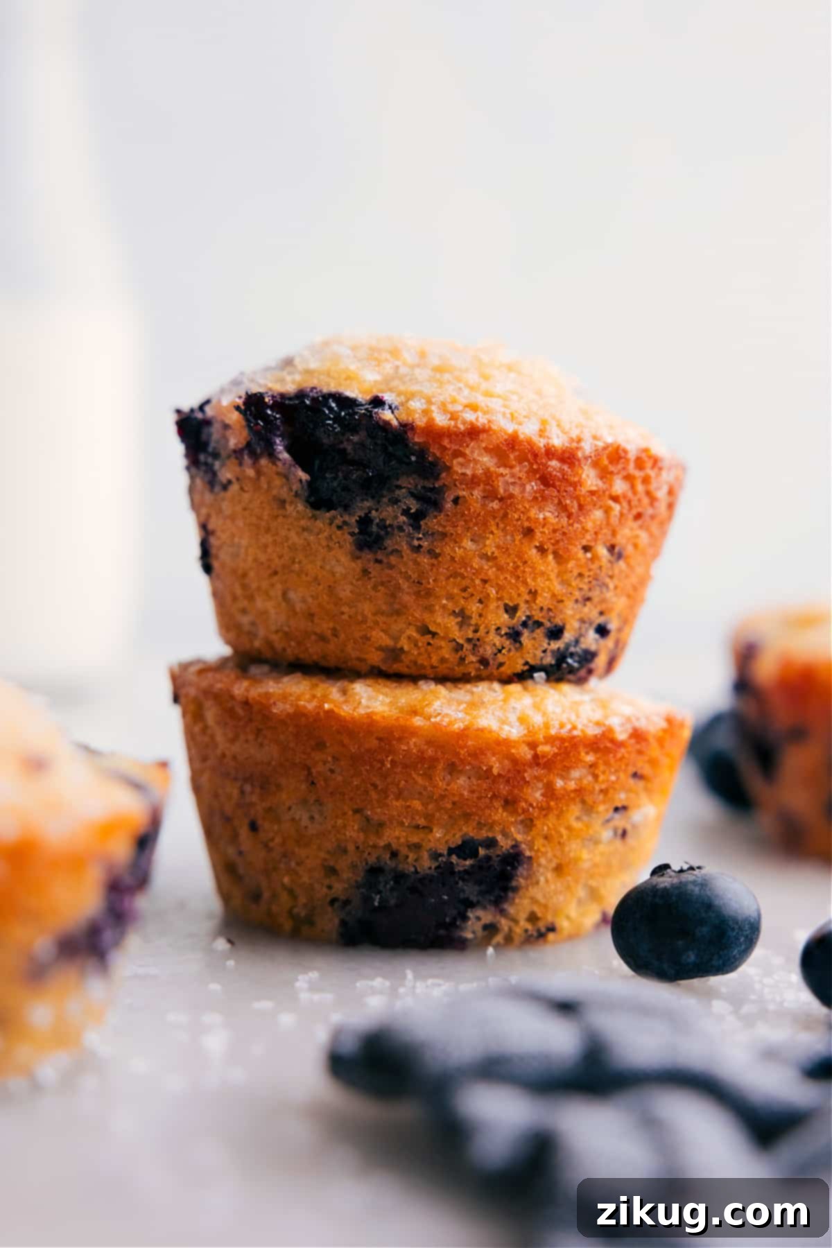 Delicious & Wholesome Healthy Blueberry Muffins Perfectly stacked healthy blueberry muffins, golden brown with visible blueberries, ready to be enjoyed.