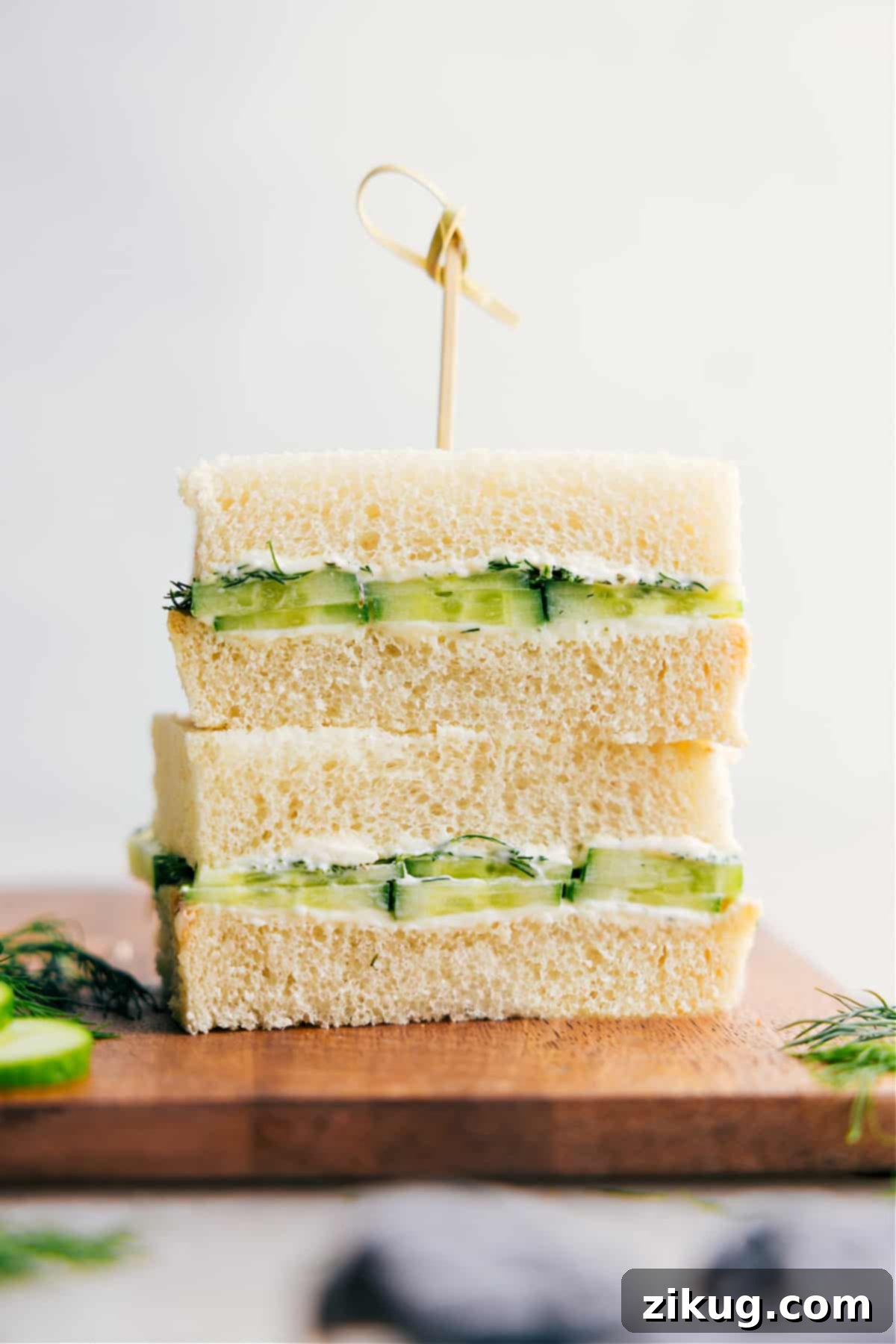 The Best Cucumber Sandwich Recipe Freshly stacked cucumber sandwiches with a creamy filling, ready to serve.