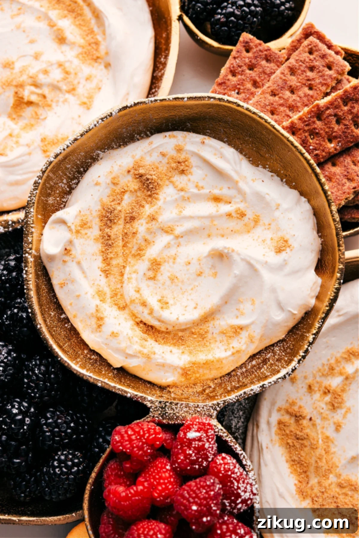 Cheesecake Dip served with graham crackers and berries