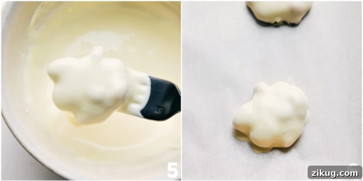 The Perfect Holiday Treat: Polar Bear Paws The Polar Bear Paws treat being dipped in white chocolate.
