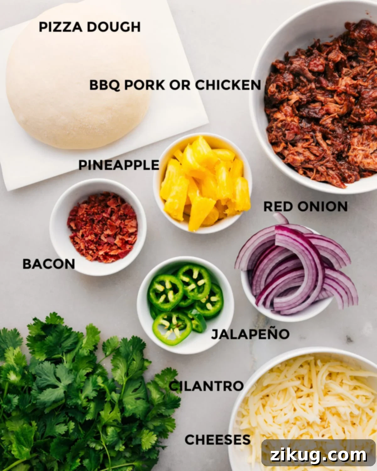 Ingredients In BBQ Chicken Pizza Recipe All the fresh ingredients prepped for making BBQ Chicken Pizza, including dough, chicken, pineapple, onion, and cheese.