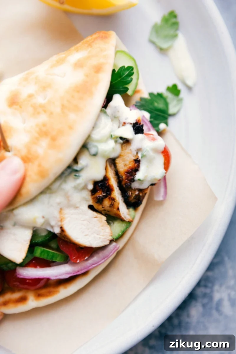 Homemade Chicken Gyro with Tzatziki A mouthwatering chicken gyro wrapped in pita, bursting with seasoned chicken, fresh veggies, and creamy tzatziki sauce.