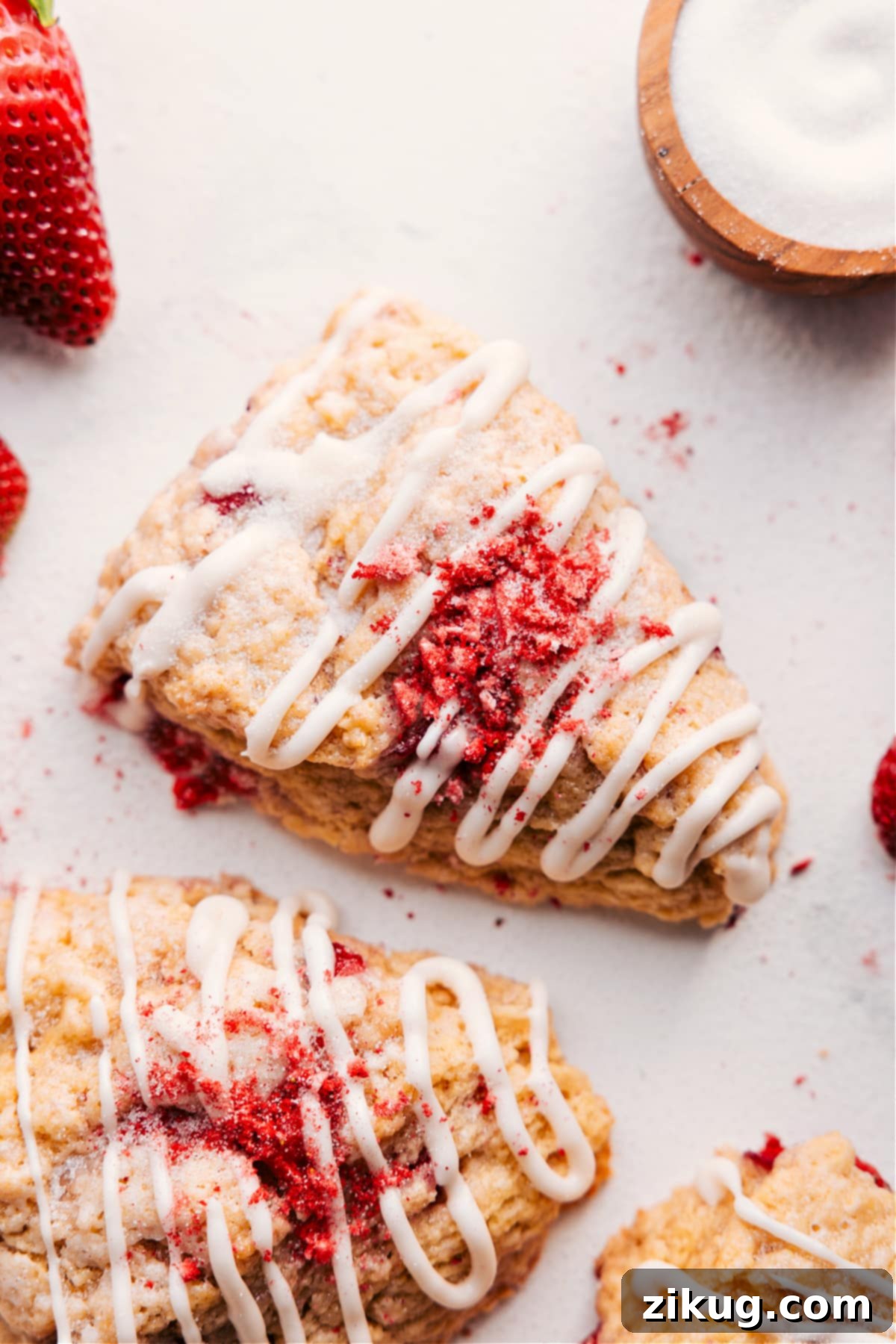 Strawberry Scones Recipe: The Perfect Morning Treat Delicious Strawberry Scones topped with sweet glaze and fresh strawberries.