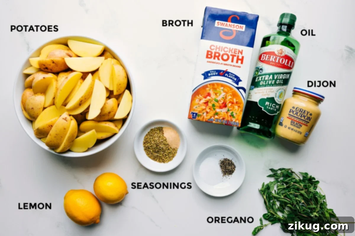 Ingredients In Greek Potatoes Recipe All fresh ingredients laid out for the Greek Potatoes Recipe: Yukon gold potatoes, vibrant lemons, fresh herbs, aromatic seasonings, chicken broth, olive oil, and Dijon mustard.