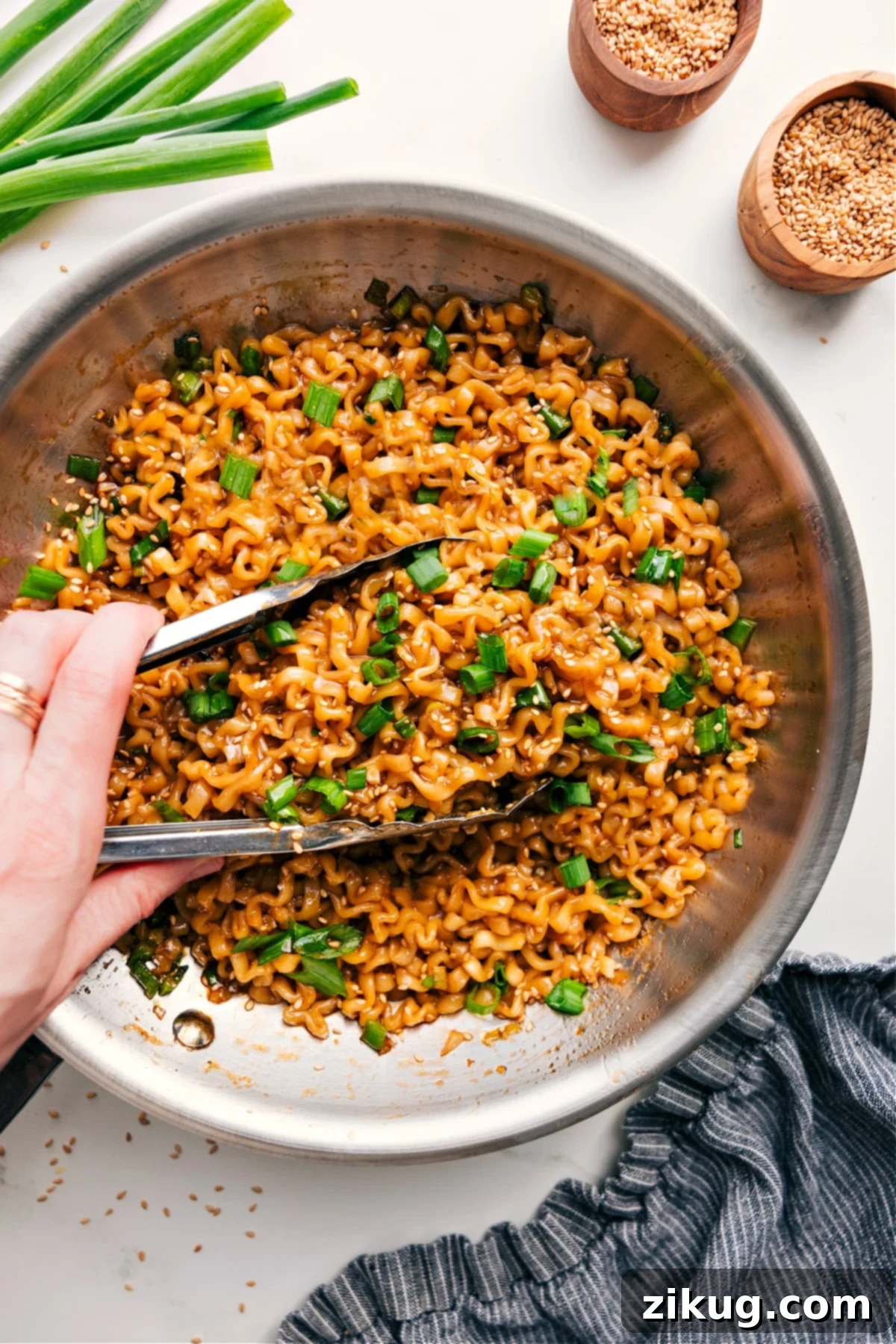 Flavor-Packed Asian Hoisin Garlic Noodle Recipe A vibrant bowl of Asian Hoisin Garlic Noodles, garnished with fresh green onions and toasted sesame seeds, ready to be enjoyed.