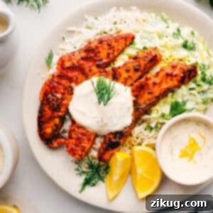 Fiery Cajun Salmon Feast 2 A beautifully plated Blackened Salmon dish with fluffy rice and crisp cabbage slaw, ready to serve.