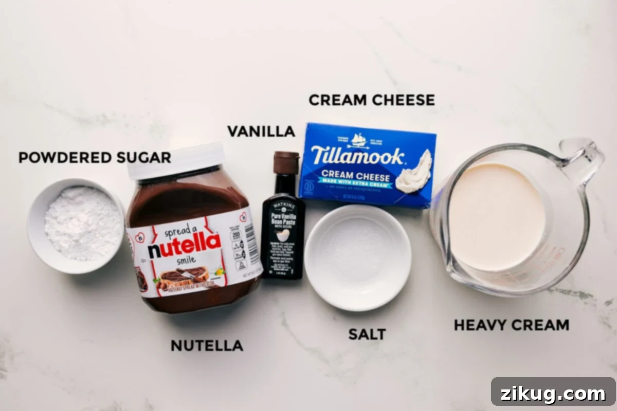 Ingredients In Chocolate Fruit Dip All the essential ingredients for making chocolate fruit dip laid out, including powdered sugar, Nutella, vanilla extract, cream cheese, salt, and heavy cream.